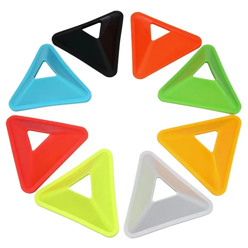 Set of triangle sign plates in various colours for football training obstacle courses on grass
