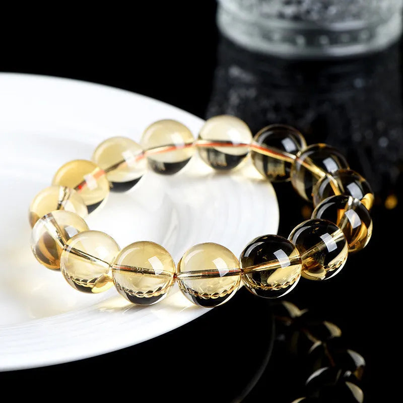 Original design natural citrine scattered beads ball bracelet showing polished yellow stones.
