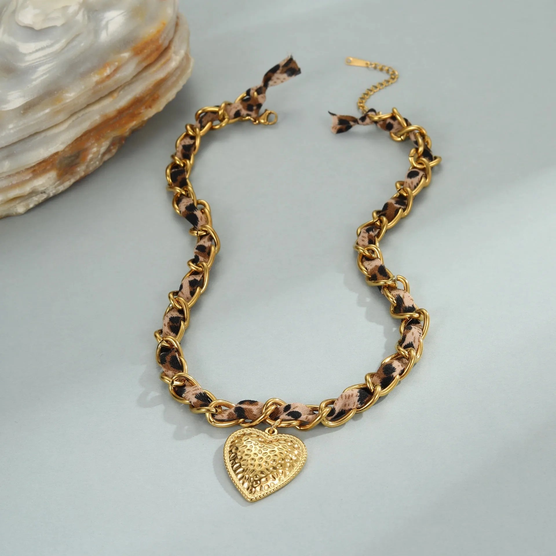 Stainless steel necklace with geometric leopard and heart pendant on adjustable chain