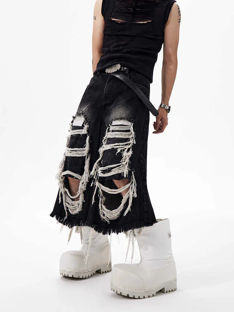 Black women's cropped wide-leg jeans with mid-high waist and ripped patch detail