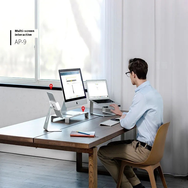 Black aluminium alloy laptop stand with open-frame design measuring 29.9cm wide on wooden desk