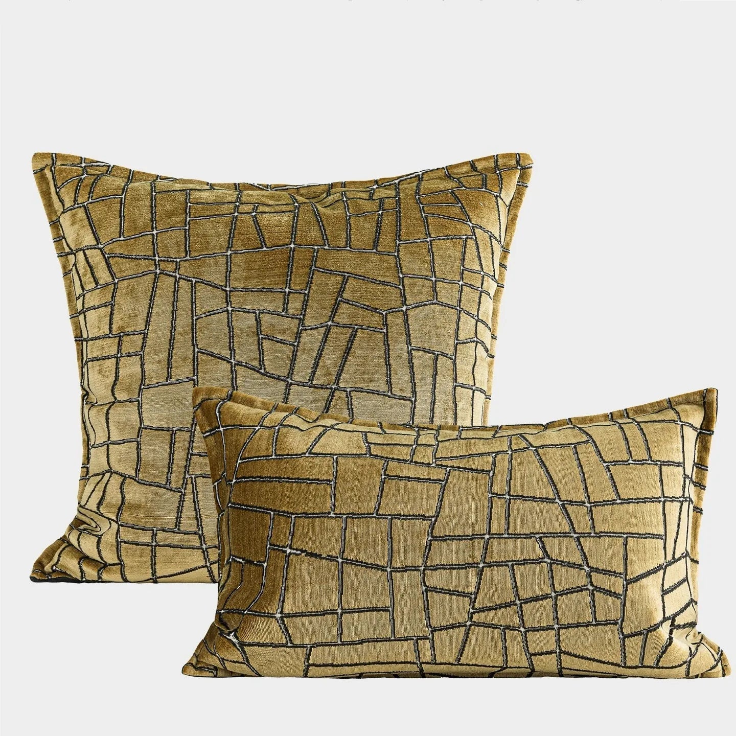 Gold and white abstract geometric patterned cushion cover on a grey sofa, showing 45x45cm square size option.