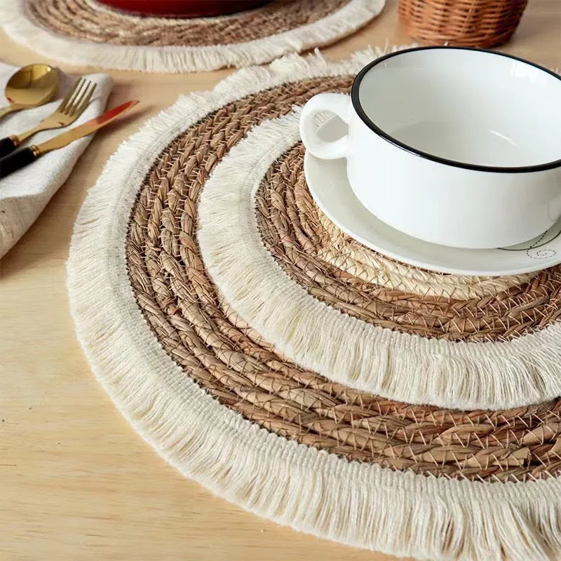 Round Japanese straw placemat with tassel detailing in papyrus material, available in four diameter sizes