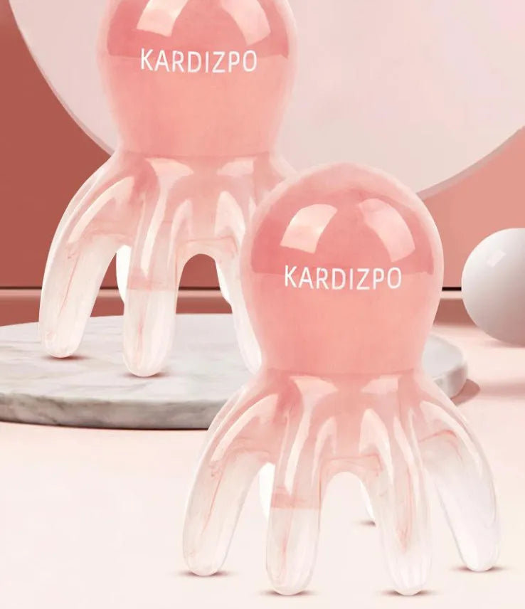 Pink natural resin octopus-shaped massage comb for periocular meridian health massage.