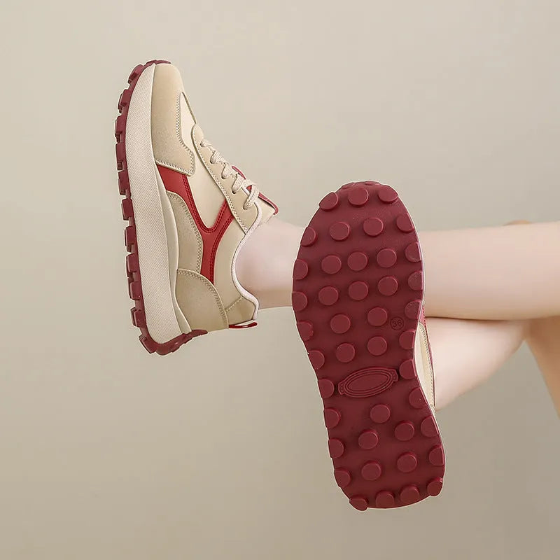 Women's low-top platform sports running shoes in solid colours with flat rubber sole and lace-up front.