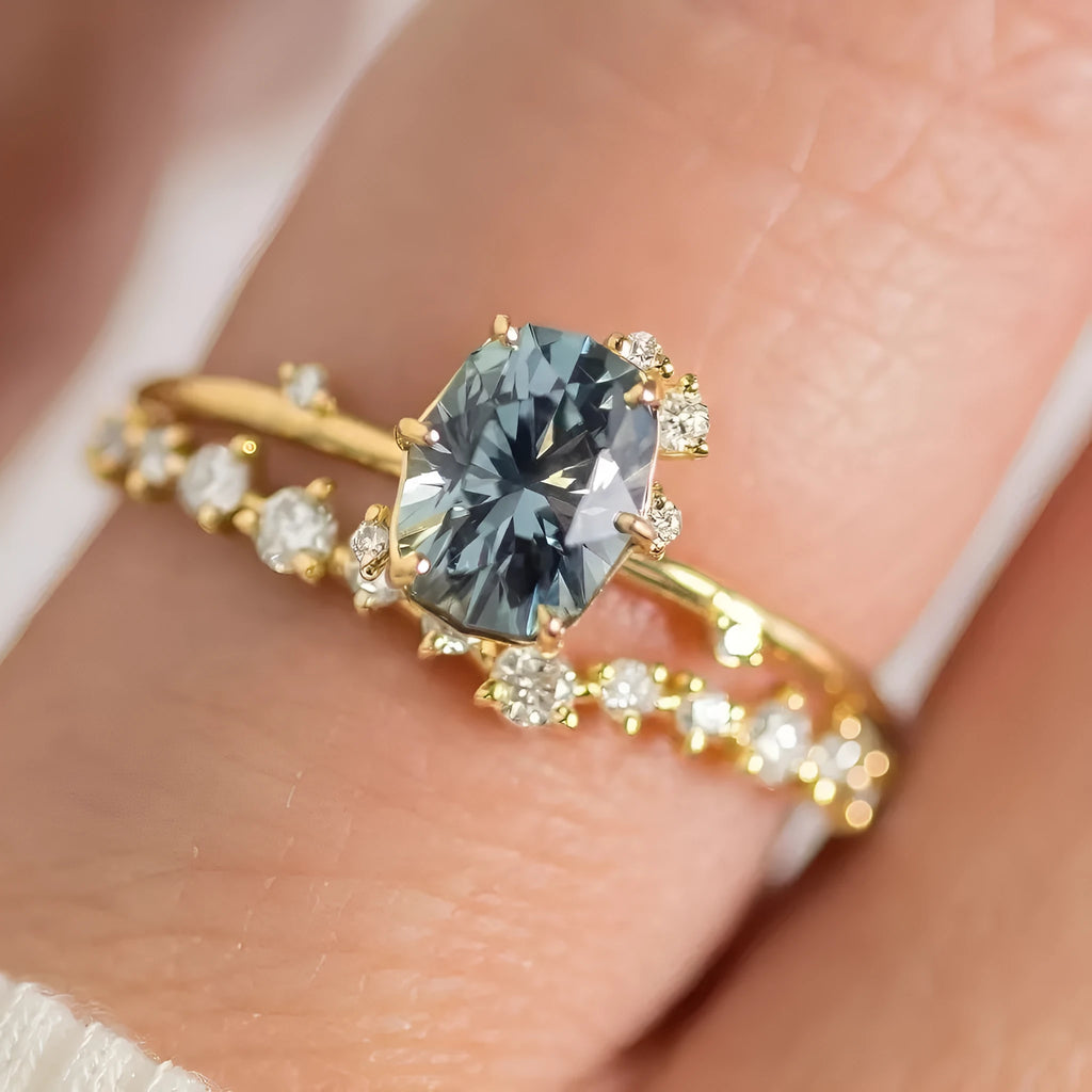 Gold plated floral women's ring with a central green zircon stone.