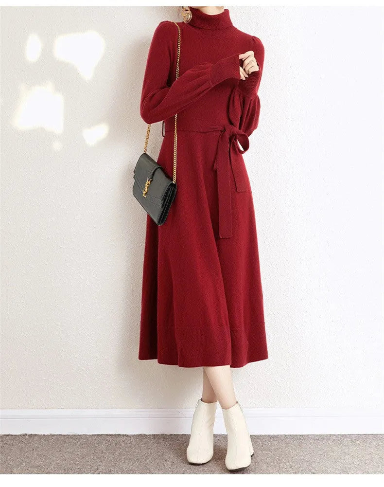 Loose-fit turtleneck knit dress for women with long sleeves, elastic waist, and a flowing mid-length princess skirt.
