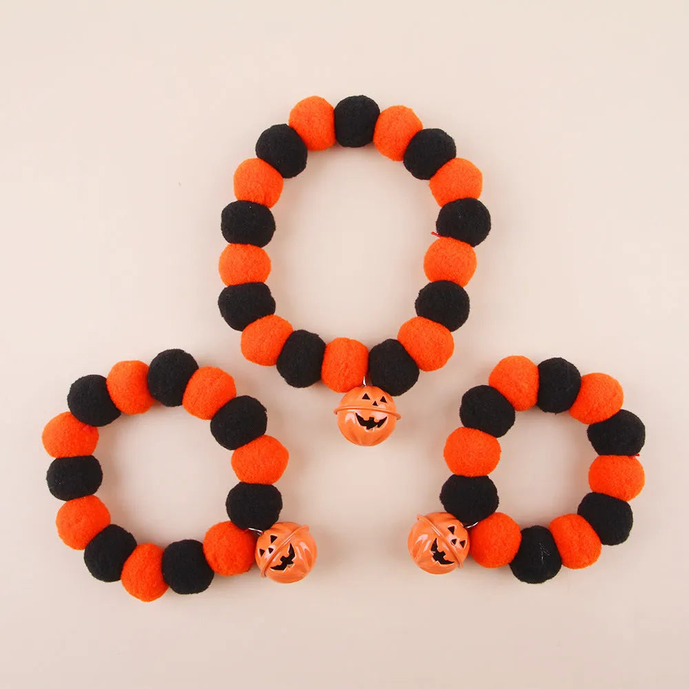 Halloween pumpkin-themed cat collar with Trick or Treat text and adjustable buckle.