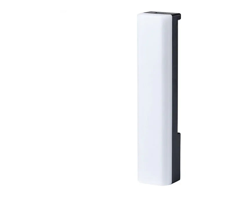 Black and white 3D RGB voice-activated music rhythm ambiance lamp on a table.