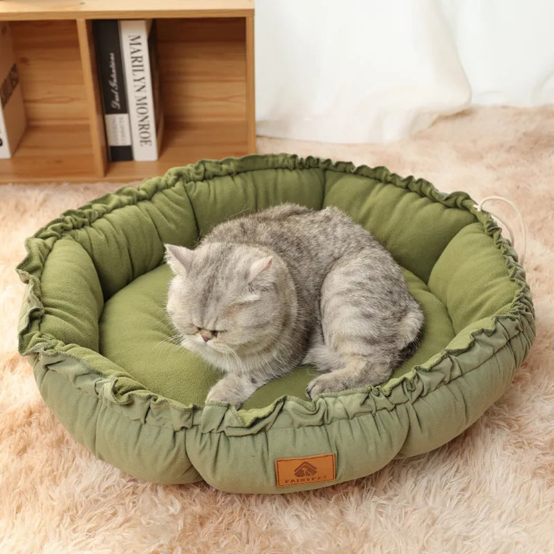 Reversible grey donut cat bed shown in both raised and flat configurations