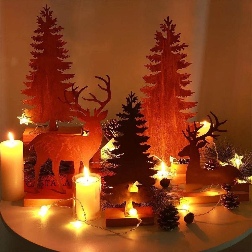 Three metal Christmas tree ornaments with elk silhouettes and rustic rust-effect finish