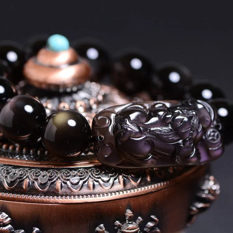Polished crystal Pi Xiu bracelet with geometric beads in ice stone colour, showing size options on wrist.