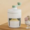 Hand-cranked ice shaving machine in green with removable ice box and ergonomic handle