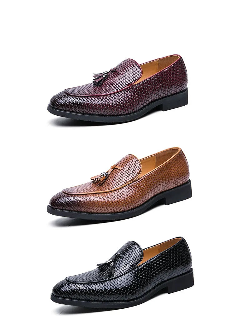 Men's black pointed toe slip-on business shoes with a tassel decoration on the front.