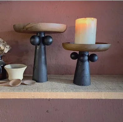 Nordic high-legged wooden round tray displaying candles and perfume bottles