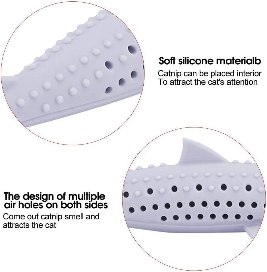 Green silicone fish-shaped cat chew toy with side holes on a white background