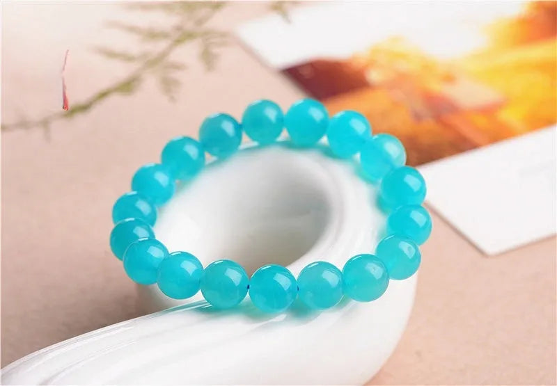 Grade 7A Amazonite natural stone scattered beads in ice colours for bracelet making, shown with a finished crystal bracelet.