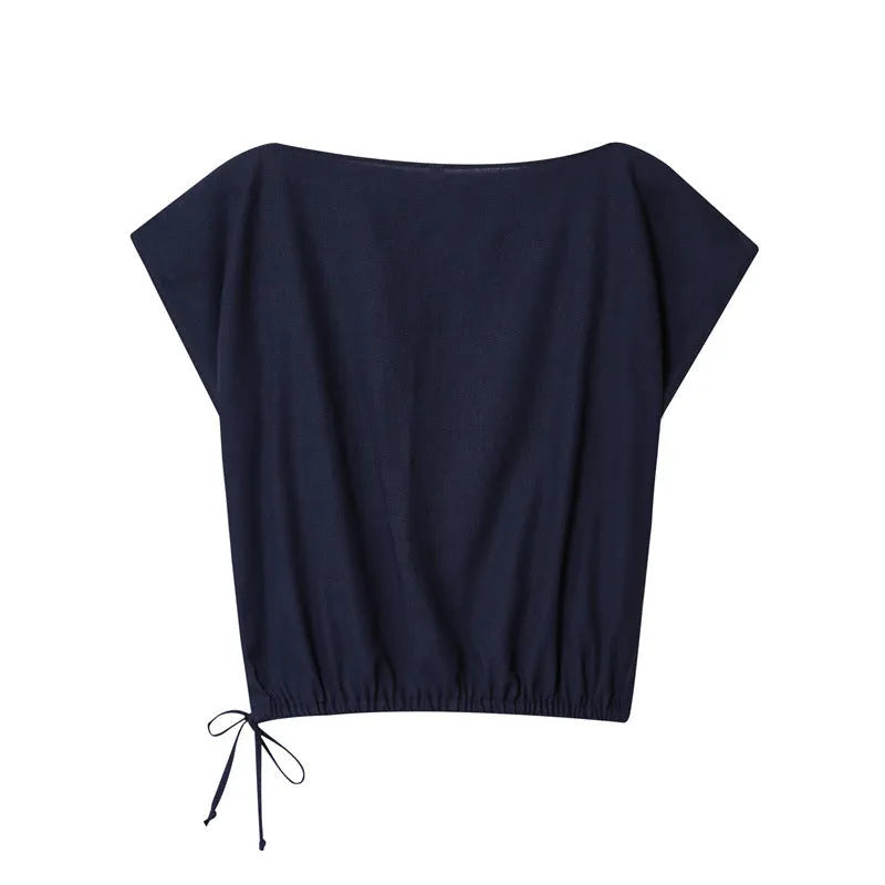 Women's linen blend co-ord set showing flounced sleeve off-neck top with wide leg trousers in temperament commute style