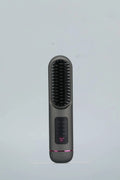 Portable charging negative ion straight hair comb in white, dark blue, or grey colour.