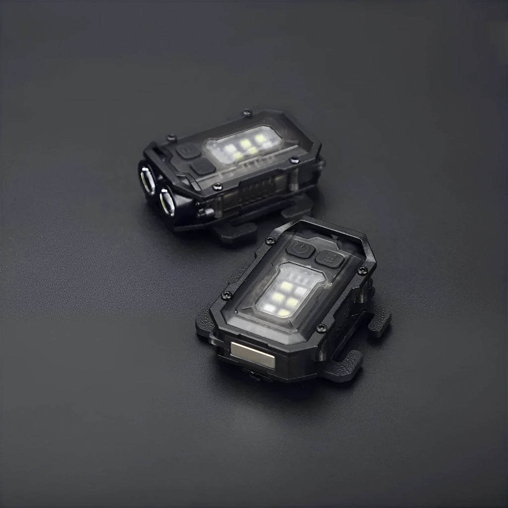 Compact black tactical warning flashlight with a USB charging cable and a clip for backpack mounting.