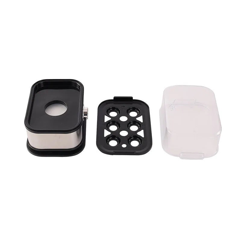 Black portable stainless steel egg boiler with a carrying belt.