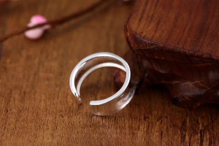 Geometric open ring with frosted sterling silver finish and adjustable opening design