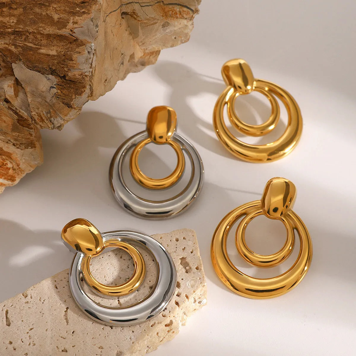 Round geometric gold-plated hollow stud earrings with double layer design on titanium steel