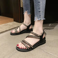 Women's gold Korean style flat sandals with rhinestone detail and elastic band