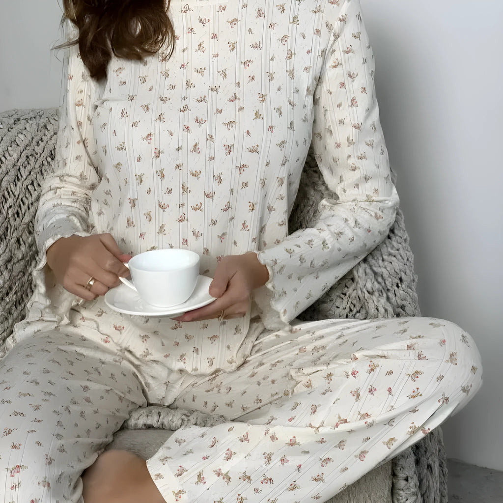 Women's white floral print pyjama set with bell sleeve top and wide-leg trousers