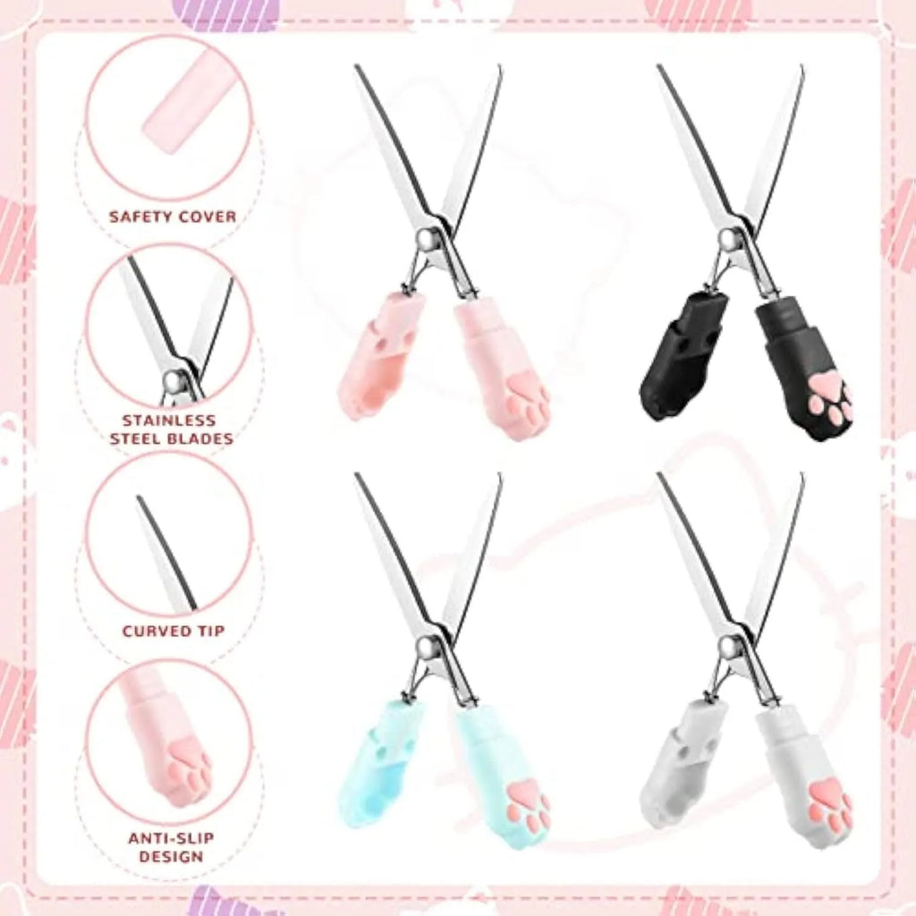 Set of four small folding scissors with cat paw handles in black, blue, pink, and white colours.