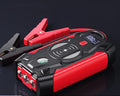 Red car emergency battery starter with digital display and air pump accessory