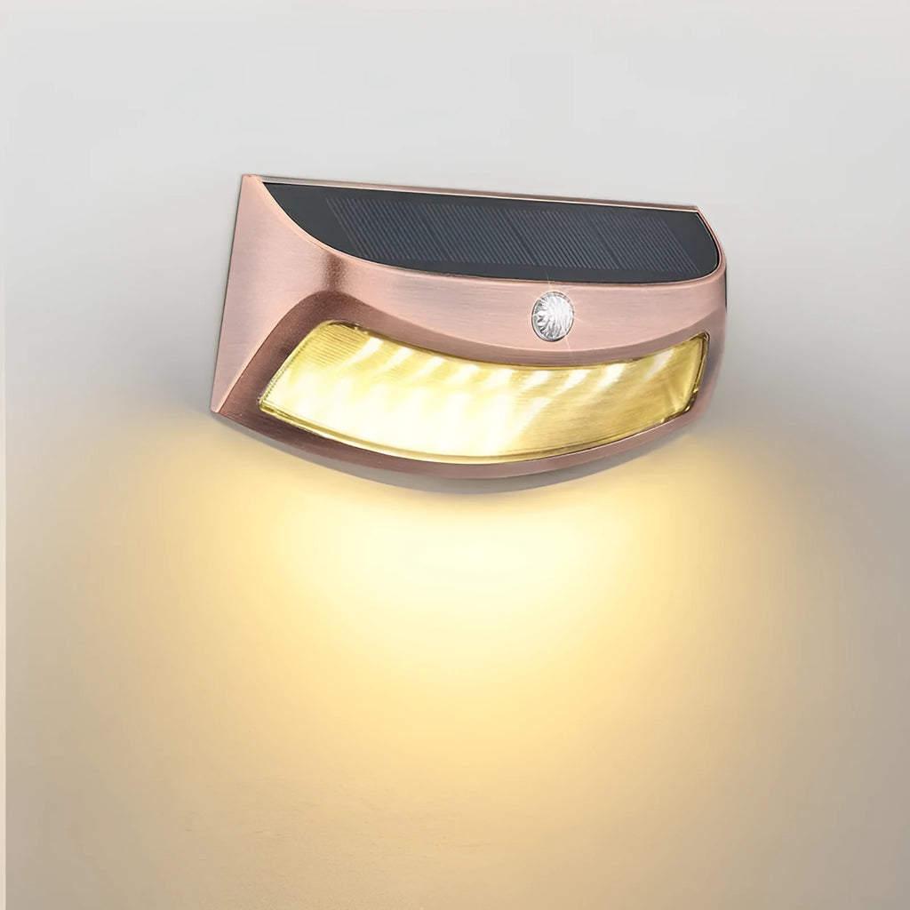Solar-powered outdoor wall lamp with smiling face design for garden courtyard lighting