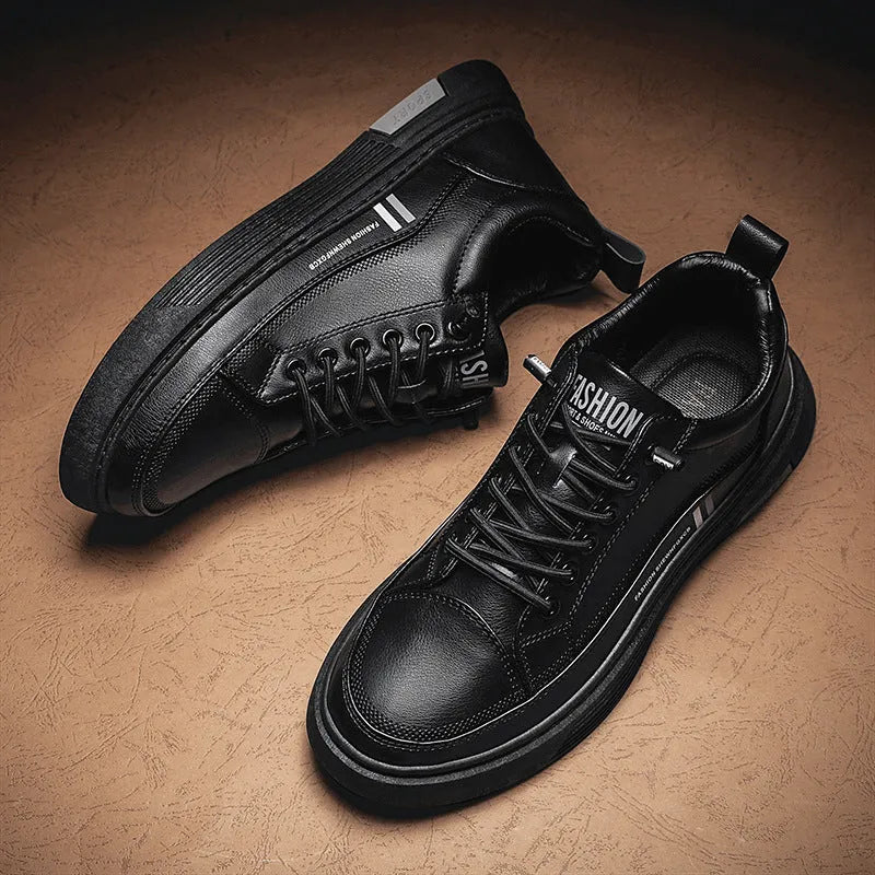 Men's low-top skate shoes in black with microfiber upper, rubber sole, and elastic band.