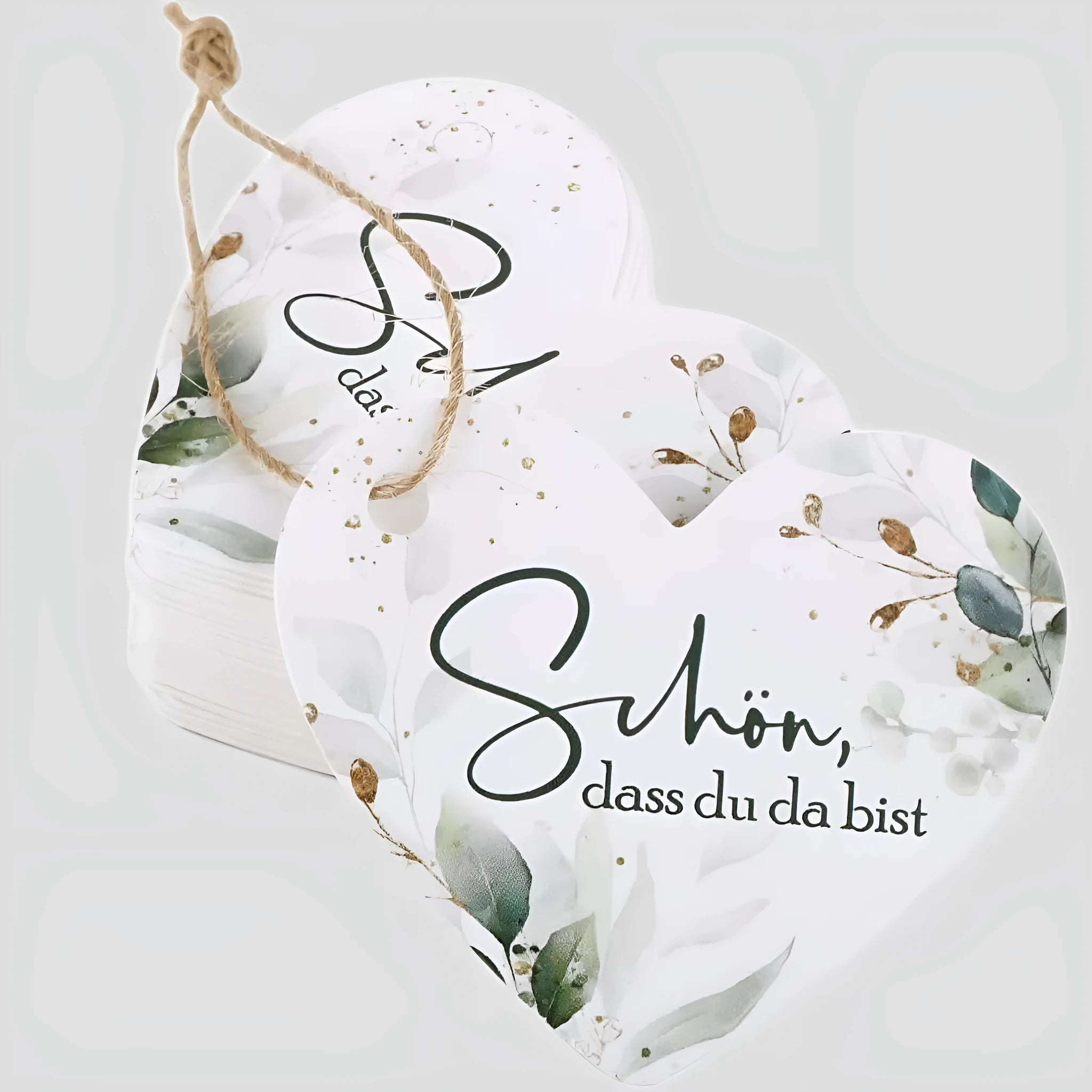 Fifty heart-shaped paper gift tags with floral design, shown in two colour style options.