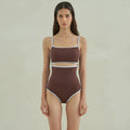 Brown triangle-style one-piece swimsuit for women on a hanger.