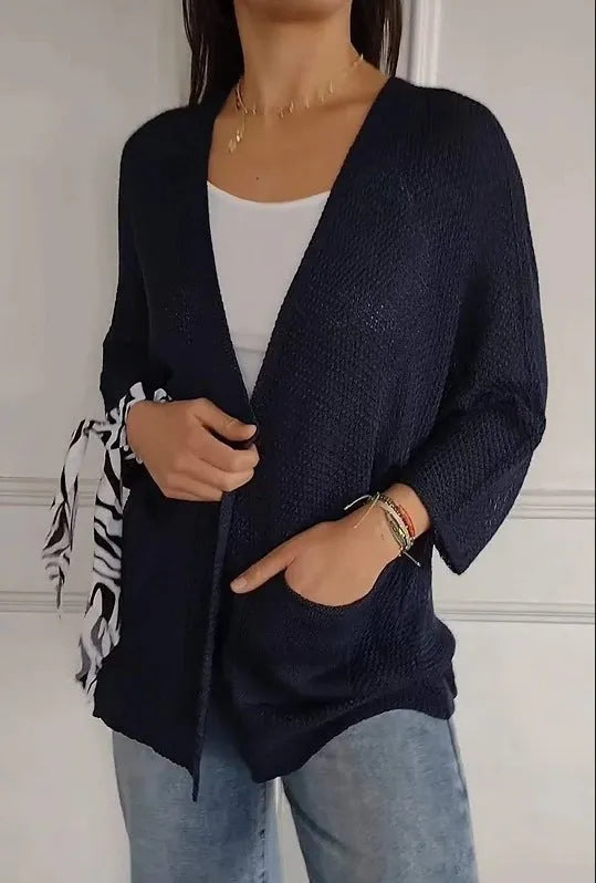 Women's waffle knit cardigan coat with nine-quarter sleeves in army green colour showing pocket detail