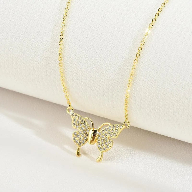 Women's gold tone butterfly necklace with twisted chain and magnetic clasp