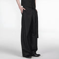 Black straight-leg trousers made from Tencel and cotton blend with a single pleat and adjustable waistband.