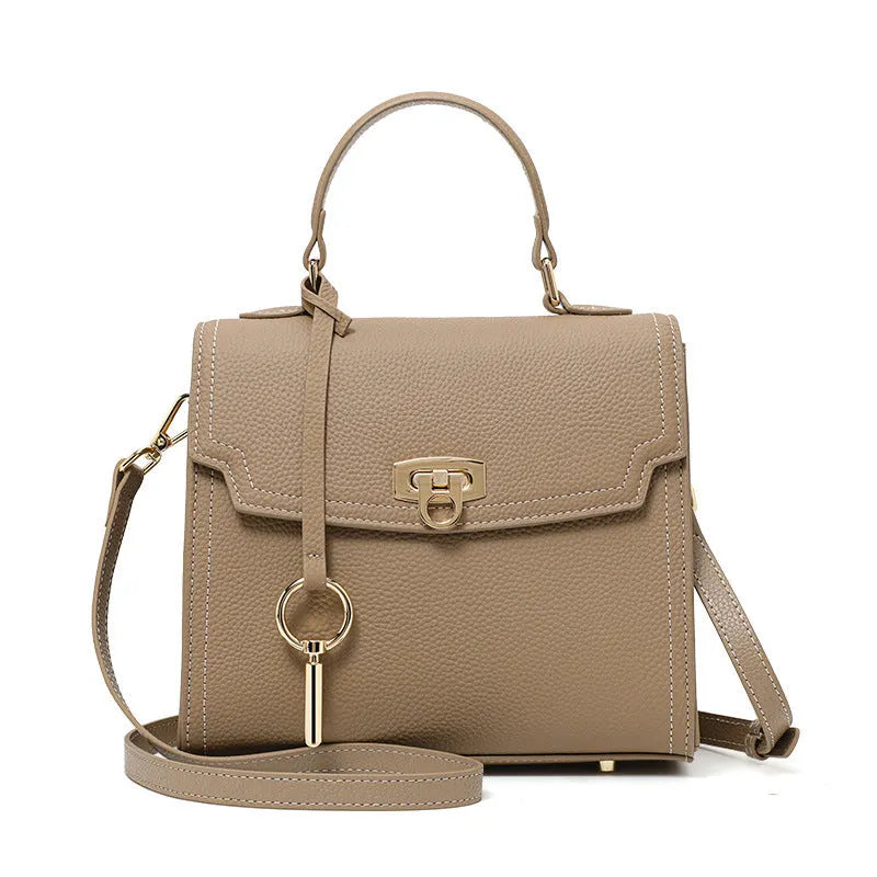 Elephant grey vintage handbag with lock closure and textured litchi pattern leather