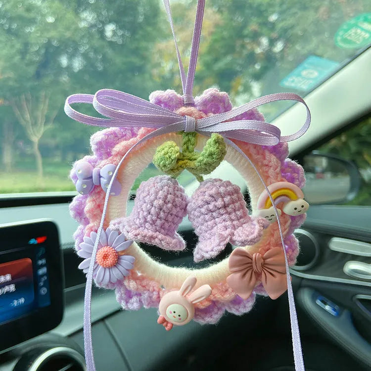 Hand-woven wool bell orchid car pendant in green, pink, purple, and yellow colour variations