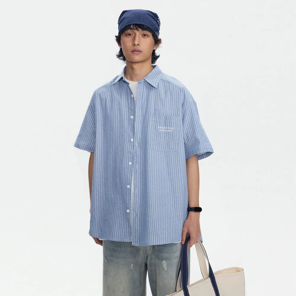 Blue striped loose-fit overalls shirt with short sleeves and cardigan style