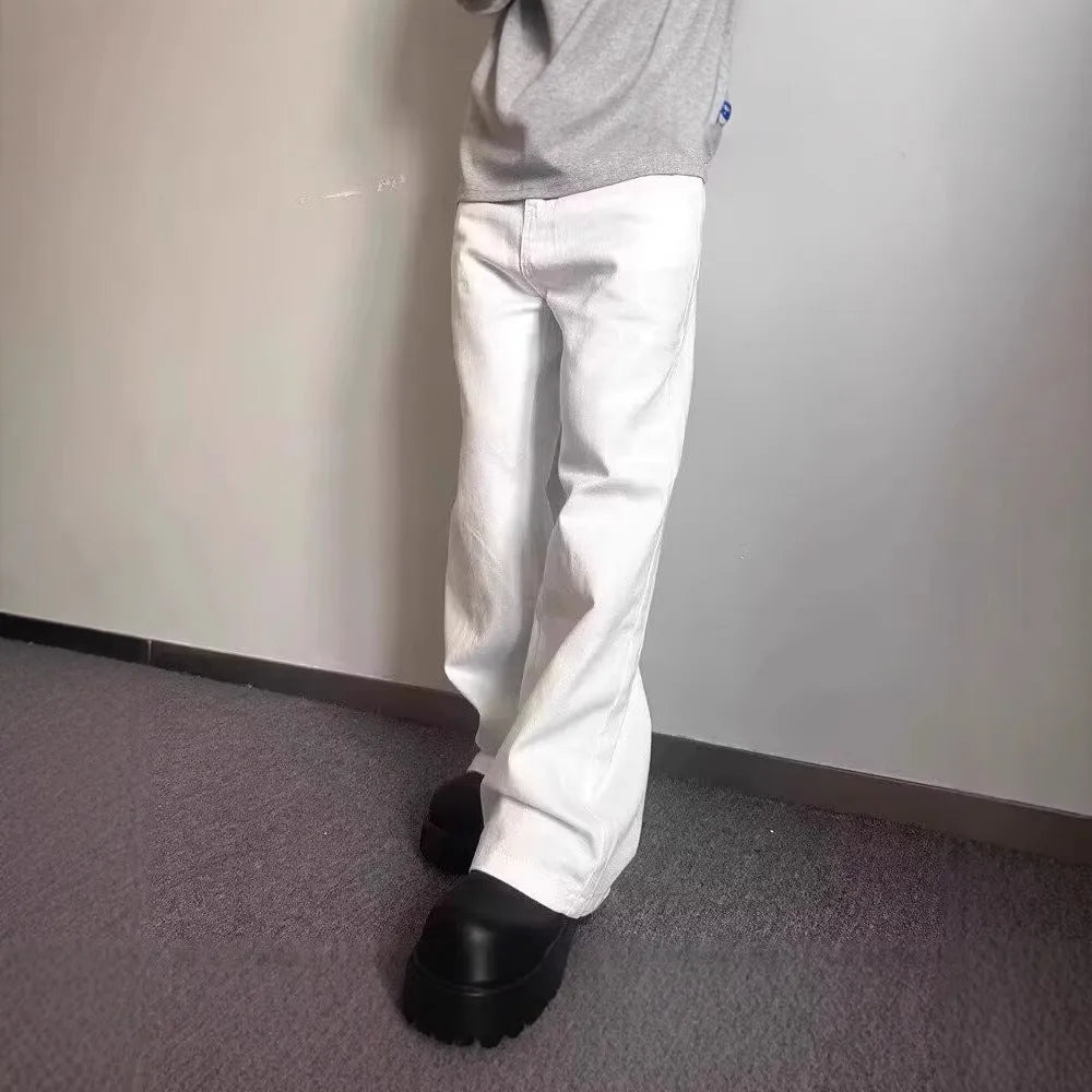 Men's white straight-leg cotton denim jeans on a hanger, showing front view with zipper fly.
