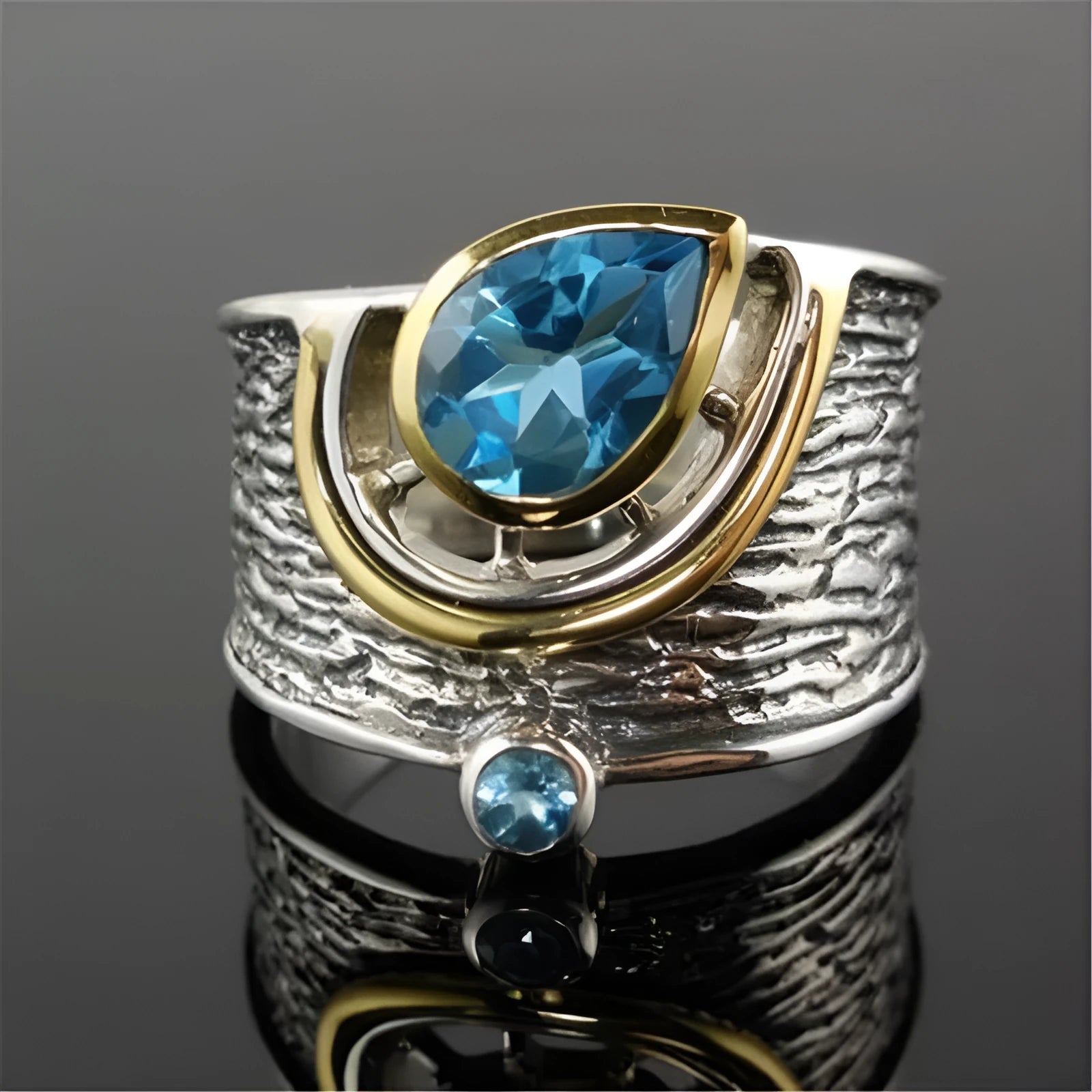 Blue drop-shaped women's ring with inlaid zircon rhinestones on an alloy band.