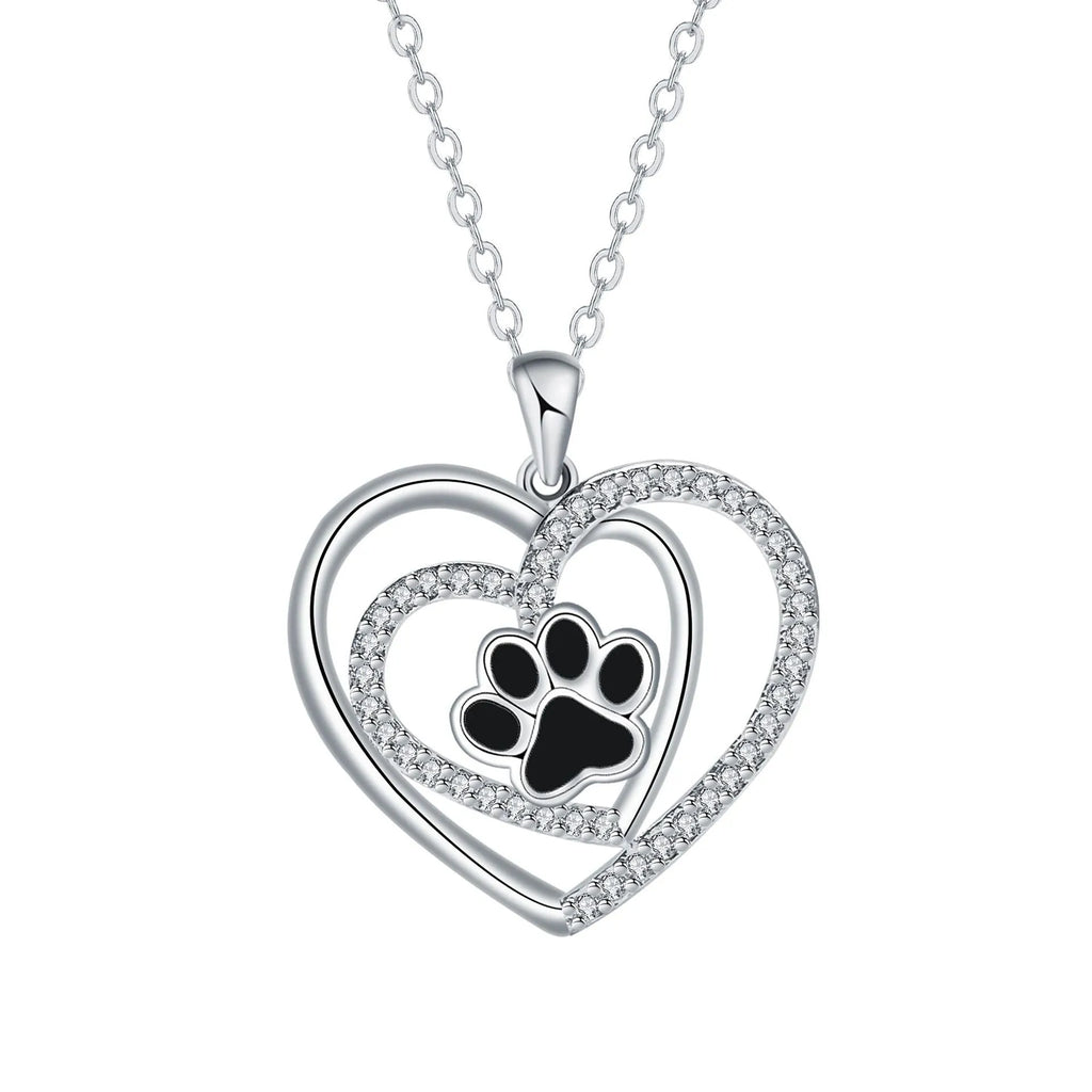 Close-up of a women's copper necklace with a heart-shaped dog's paw print pendant.