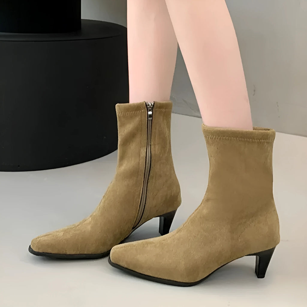 Brown women's retro ankle boots with a square toe, side zip, and a mid-height stiletto heel on a white background.