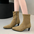 Brown women's retro ankle boots with a square toe, side zip, and a mid-height stiletto heel on a white background.