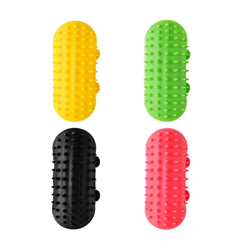 Silicone cat grooming comb with adjustable strap attached to furniture leg for scratching and hair removal