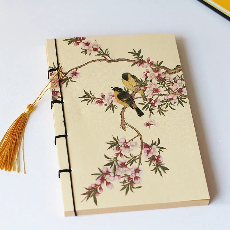 Antique wire-bound notebook with embossed cowhide cover and black wax rope binding
