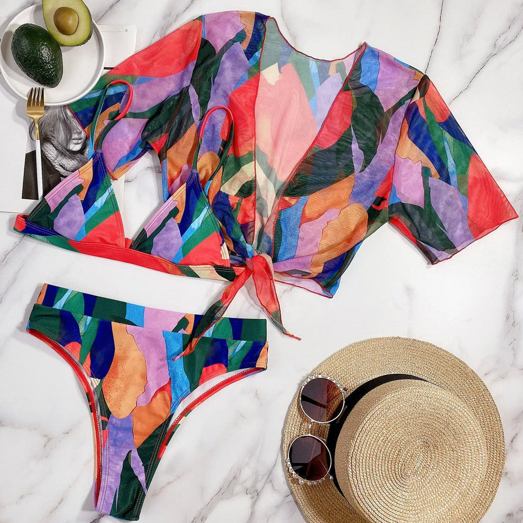 Red women's printed split design swimsuit or bikini made from nylon fabric.