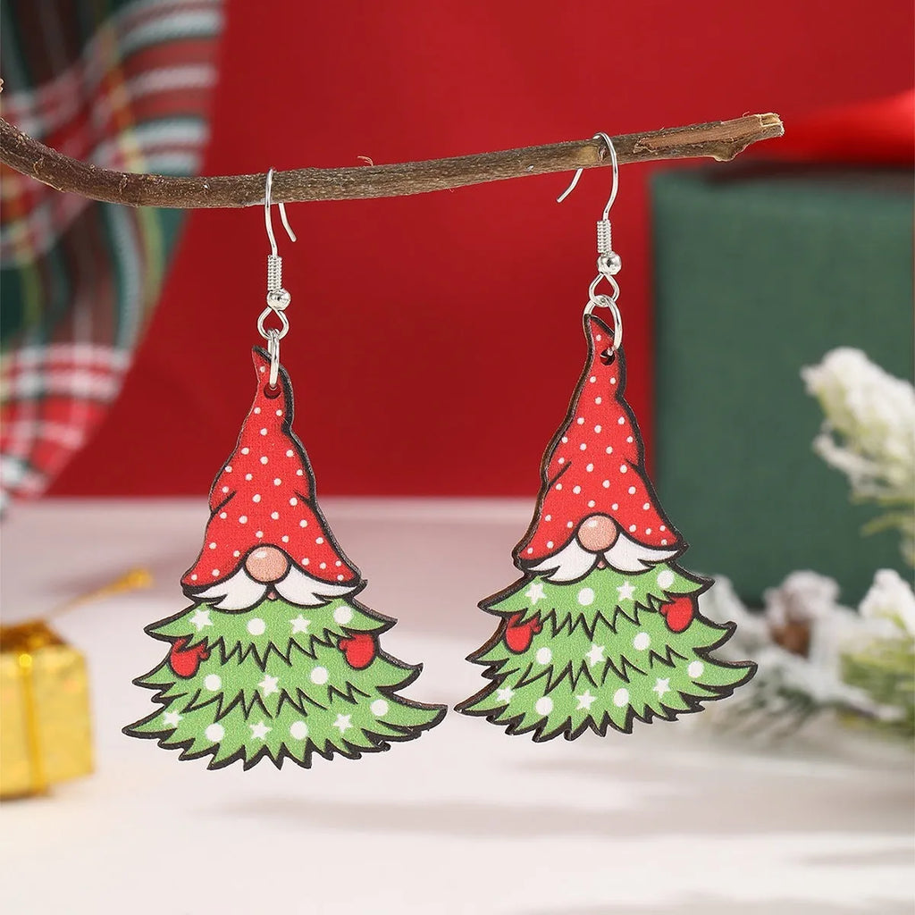 Wooden Christmas earrings with printed tree and snowman designs featuring geometric shapes